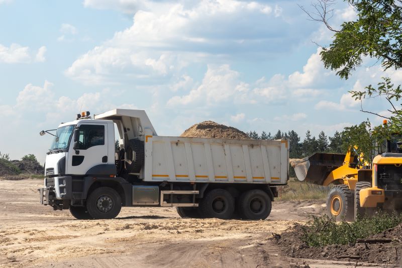 dump-truck-with-a-bunch-of-land